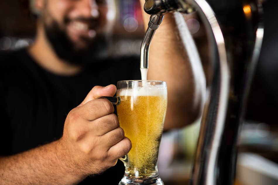 close-up-bartender-creating-delicious-drink (1)